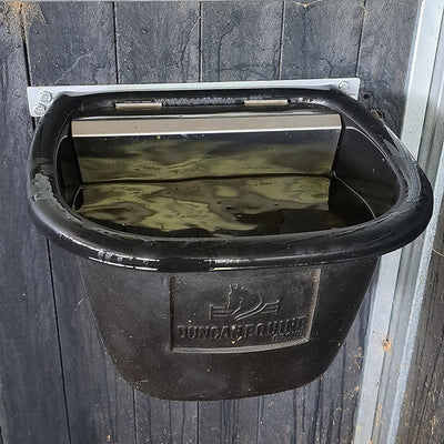 Black hanging feed container with a logo on a wooden wall
